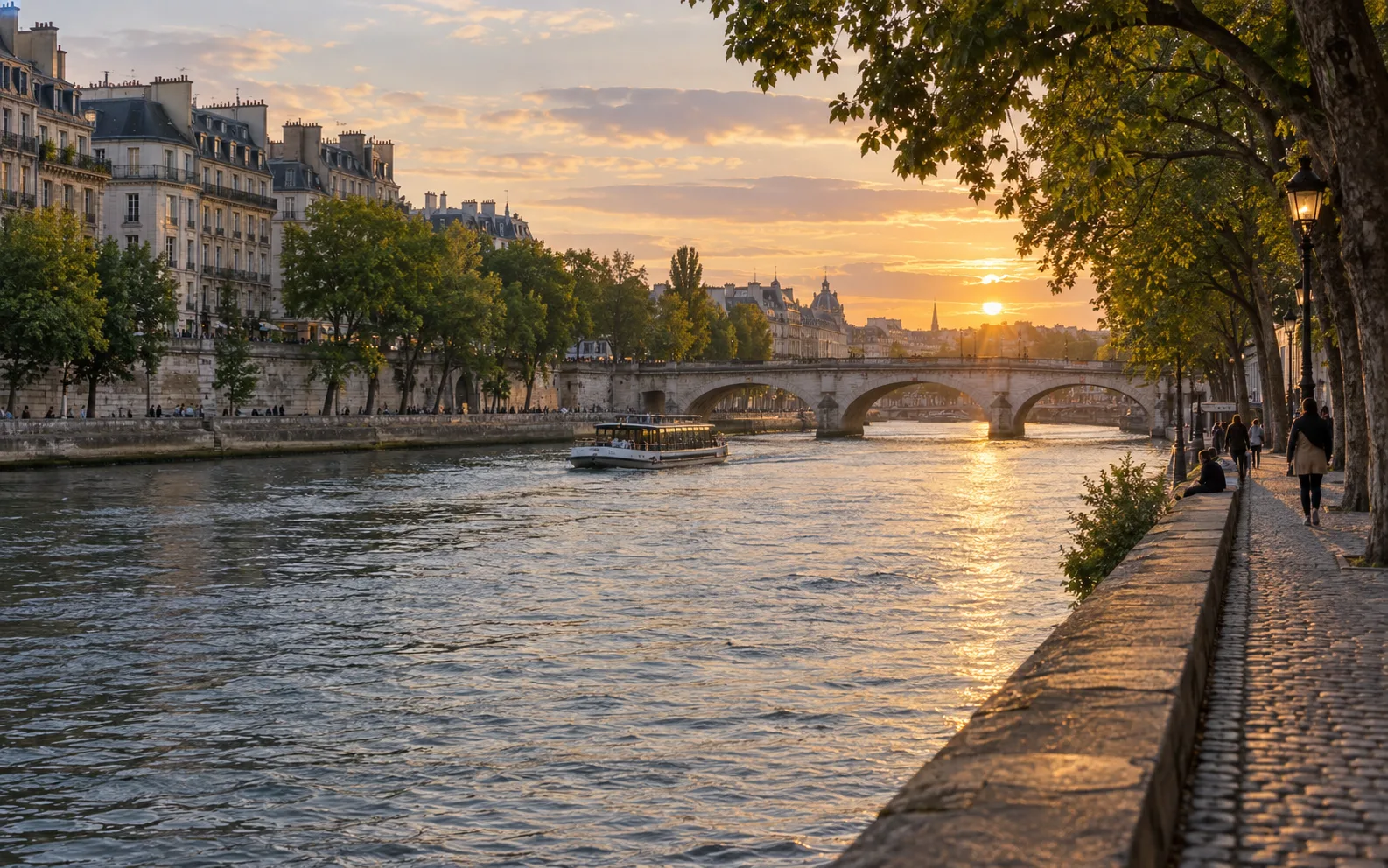 The Seine, a stone bridge and Parisian riverbanks at golden hour